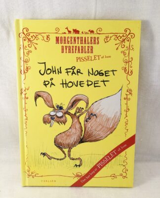 "John får noget på hovedet"